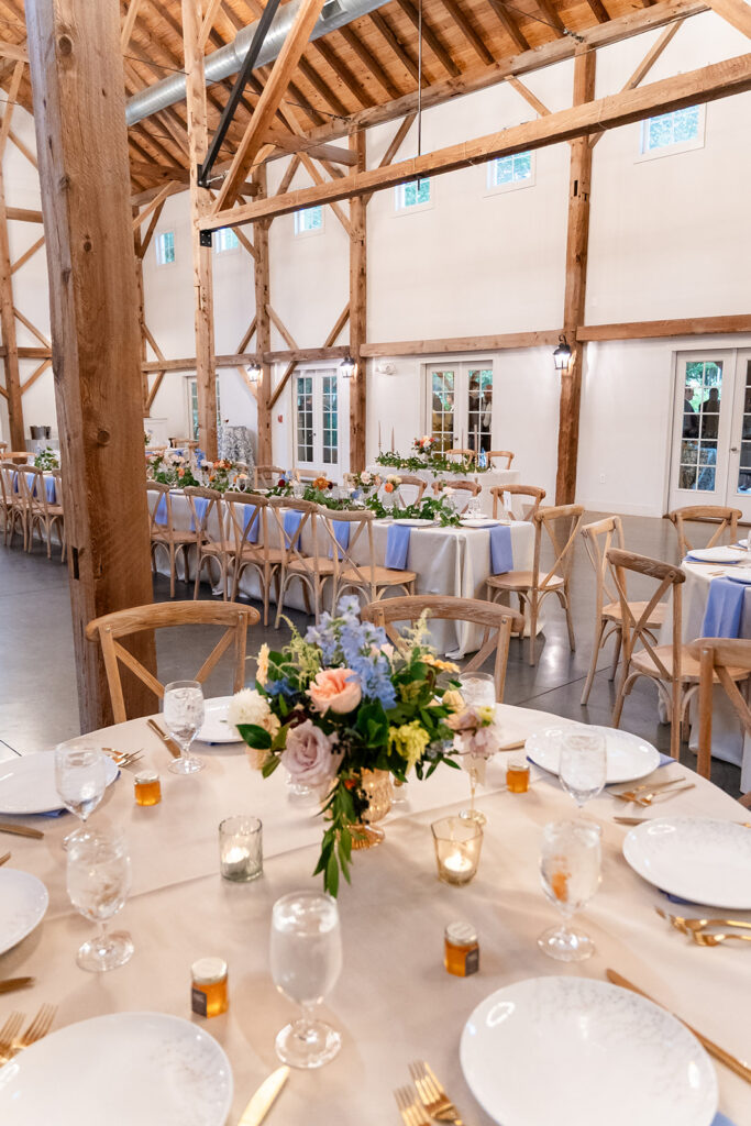 The barn of chapel hill indoor reception featuring pops of blue 